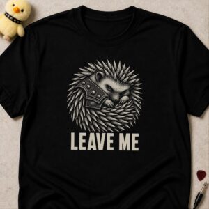 Black t-shirt printed LEAVE ME below a hedgehog curled into a ball wearing a studded collar