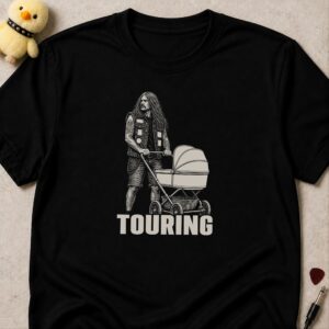 Black t-shirt printed TOURING below a tattooed long-haired man pushing a pram