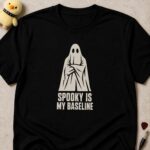 Black t-shirt printed SPOOKY IS MY BASELINE below a ghost standing with its arms folded