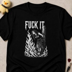 Black t-shirt printed FUCK IT in white metal lettering above a witch tied to a burning stake