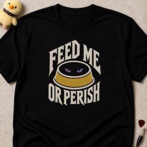Black t-shirt printed FEED ME OR PERISH around a pet bowl with glowing purple eyes inside it
