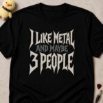 Black t-shirt printed I LIKE METAL AND MAYBE 3 PEOPLE in spiky white metal lettering