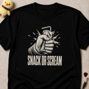 Black t-shirt printed SNACK OR SCREAM below a fist crushing a juice carton