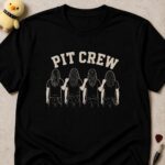 Black t-shirt printed PIT CREW above four long-haired figures seen from behind with their arms around each other