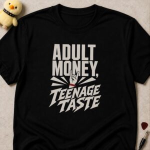 Black t-shirt printed ADULT MONEY, TEENAGE TASTE around a devil-horns hand wearing a red wristband