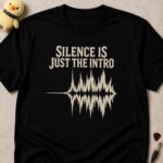 Black t-shirt printed SILENCE IS JUST THE INTRO above a flat line erupting into a loud audio waveform