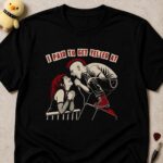 Black t-shirt printed I PAID TO GET YELLED AT above a singer leaning off stage screaming at a grinning fan at the barrier