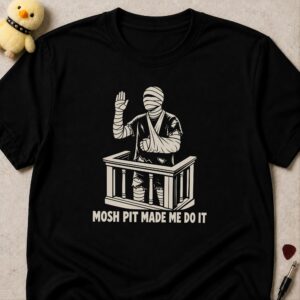 Black t-shirt printed MOSH PIT MADE ME DO IT below a bandaged man with his arm in a sling swearing an oath in a witness box