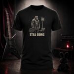 STILL GOING bigfoot at a bus stop t-shirt shown on a ghost mannequin, black, front view