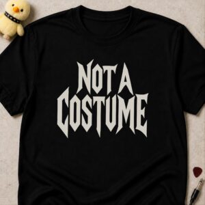 Black t-shirt printed NOT A COSTUME in white metal lettering