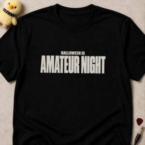 Black t-shirt printed HALLOWEEN IS AMATEUR NIGHT in bold condensed white lettering