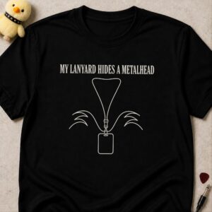 Black t-shirt printed MY LANYARD HIDES A METALHEAD above an office lanyard with long hair drawn behind it