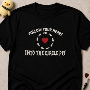 Black t-shirt printed FOLLOW YOUR HEART INTO THE CIRCLE PIT around a ring of footprints circling a red heart